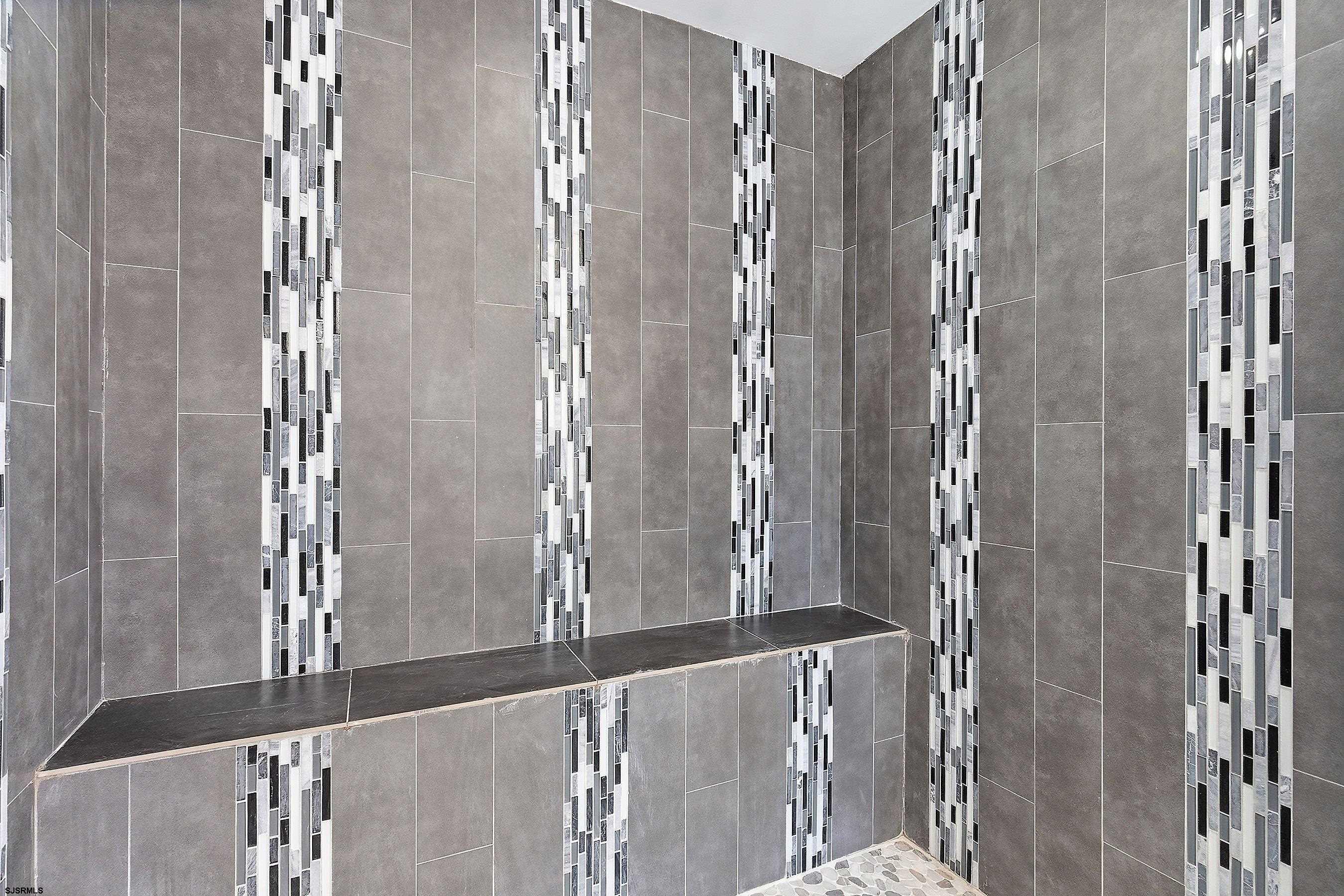 183 Jordan Road Somers Point, NJ 08244 - Photo 32 of 42 a bathroom with a glass shower door and a window