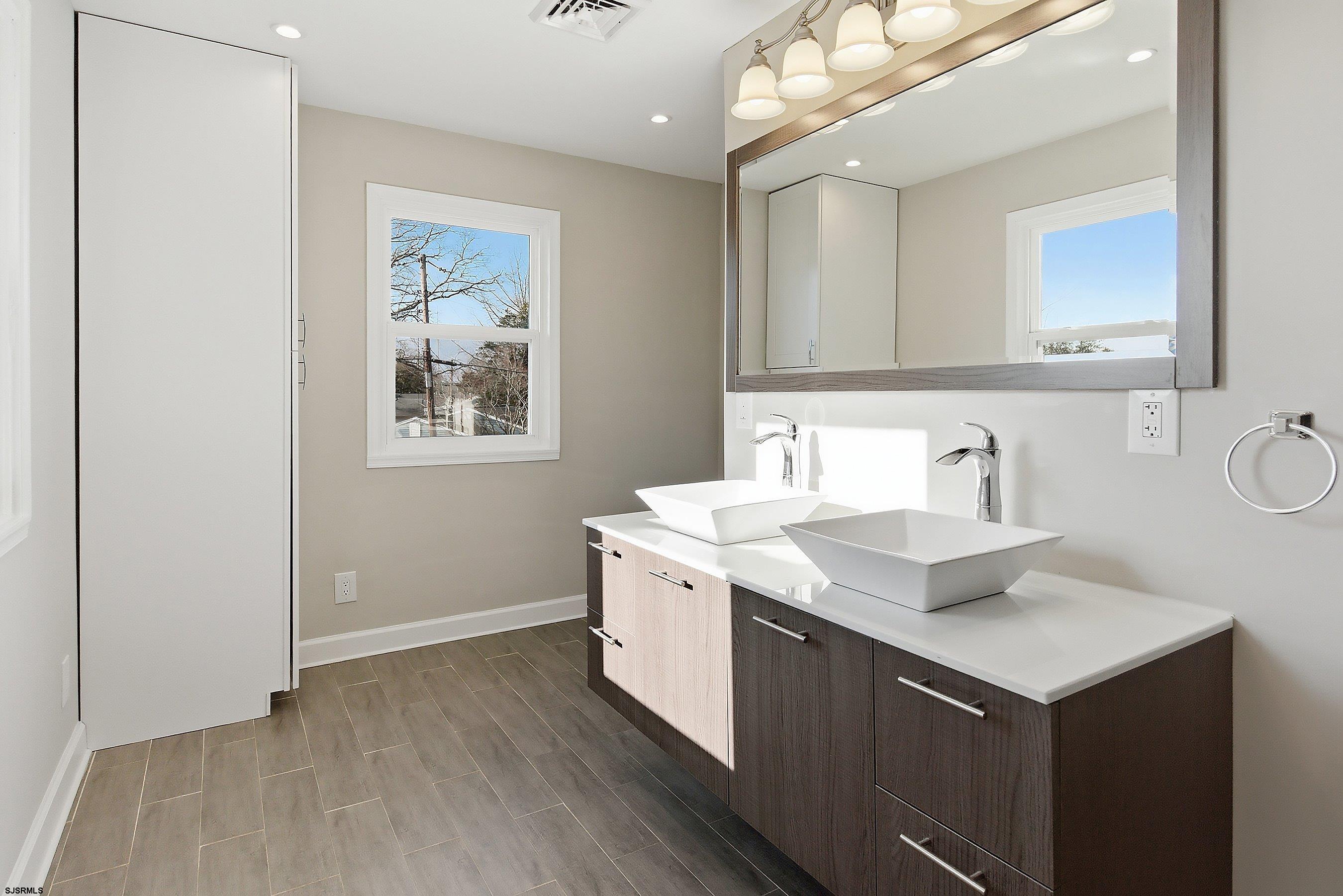 183 Jordan Road Somers Point, NJ 08244 - Photo 33 of 42 a bathroom with a sink vanity and a mirror