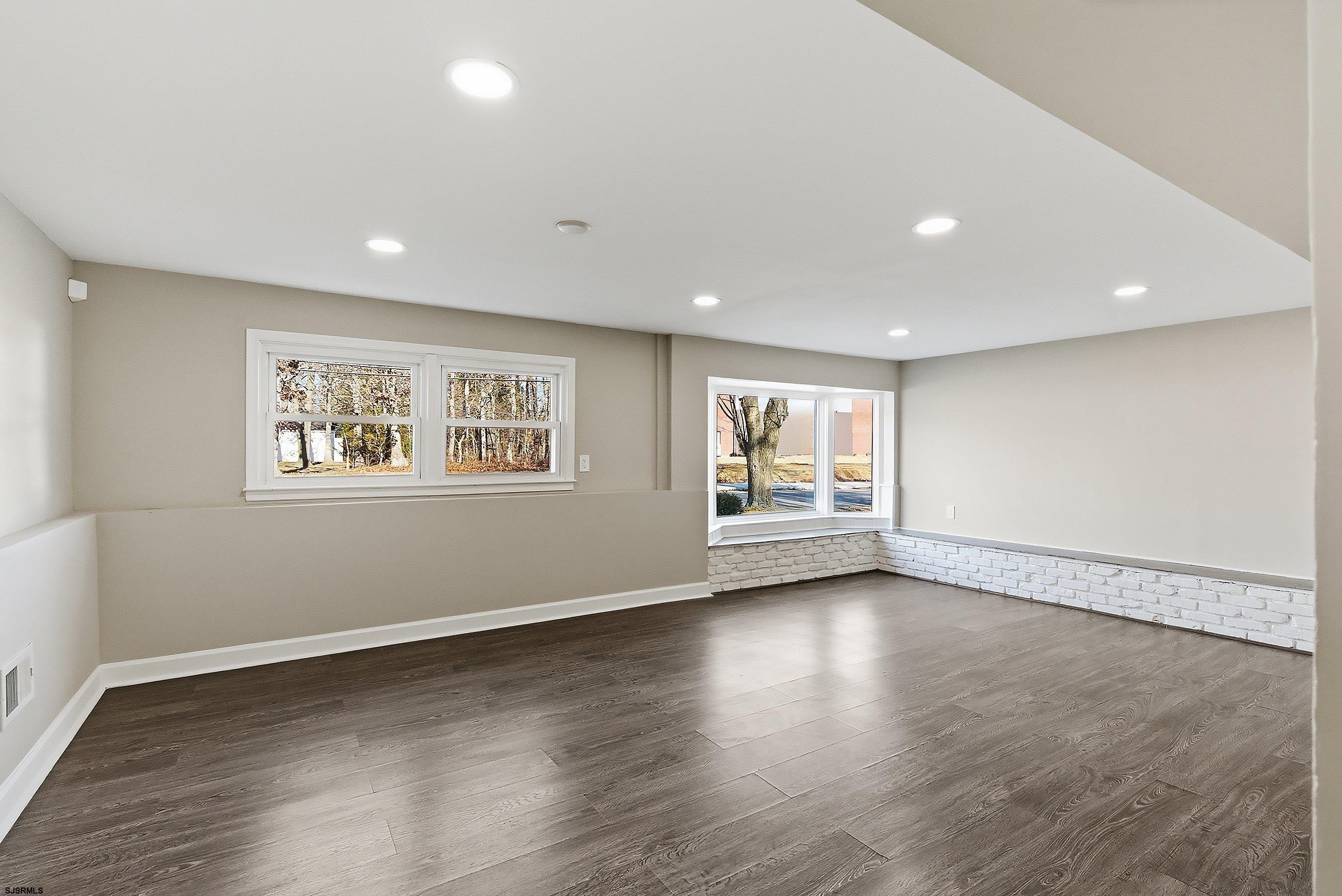 183 Jordan Road Somers Point, NJ 08244 - Photo 34 of 42 a view of an empty room with a window and wooden floor