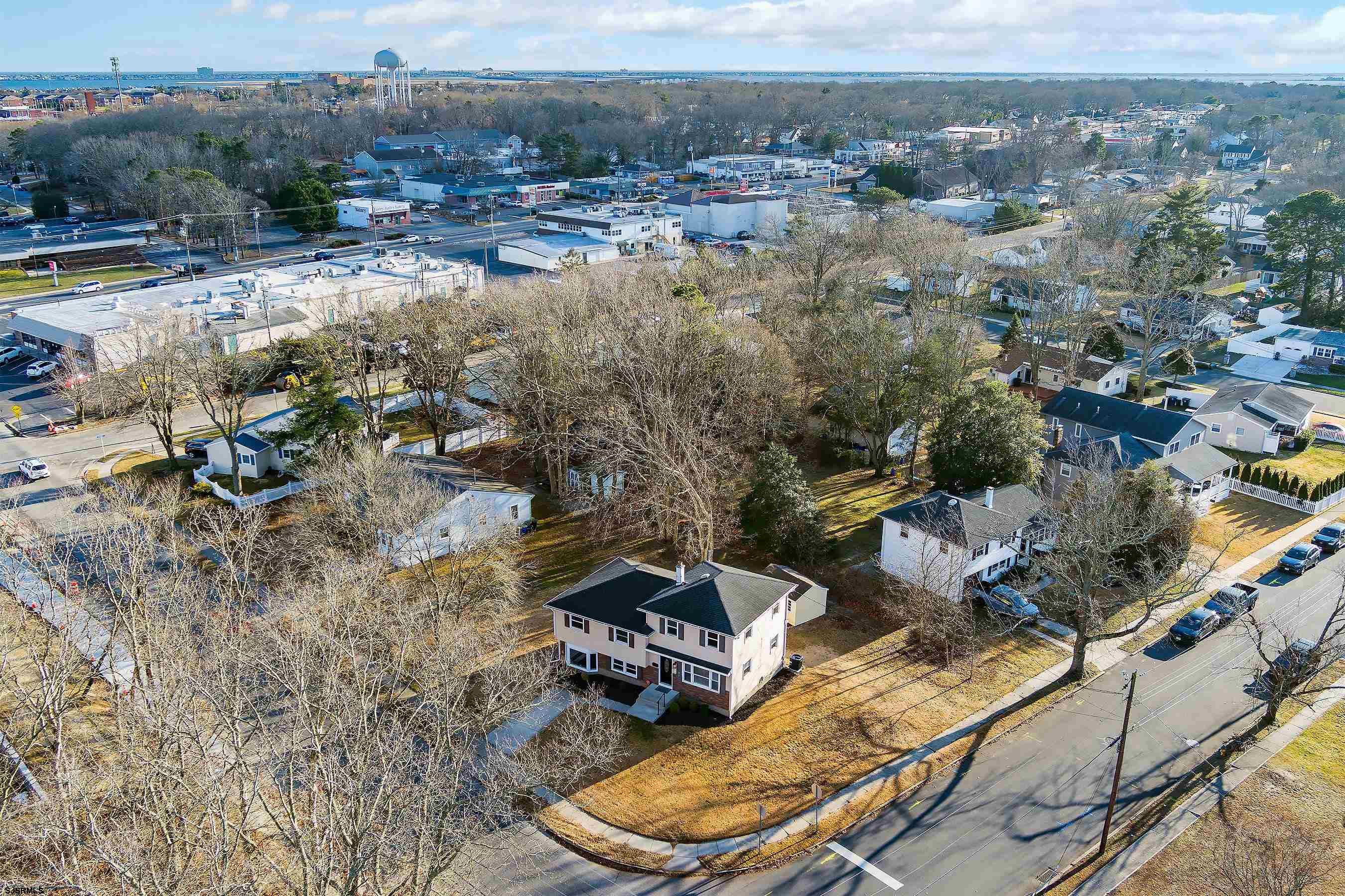 183 Jordan Road Somers Point, NJ 08244 - Photo 5 of 42 an aerial view of a house with a yard and lake view