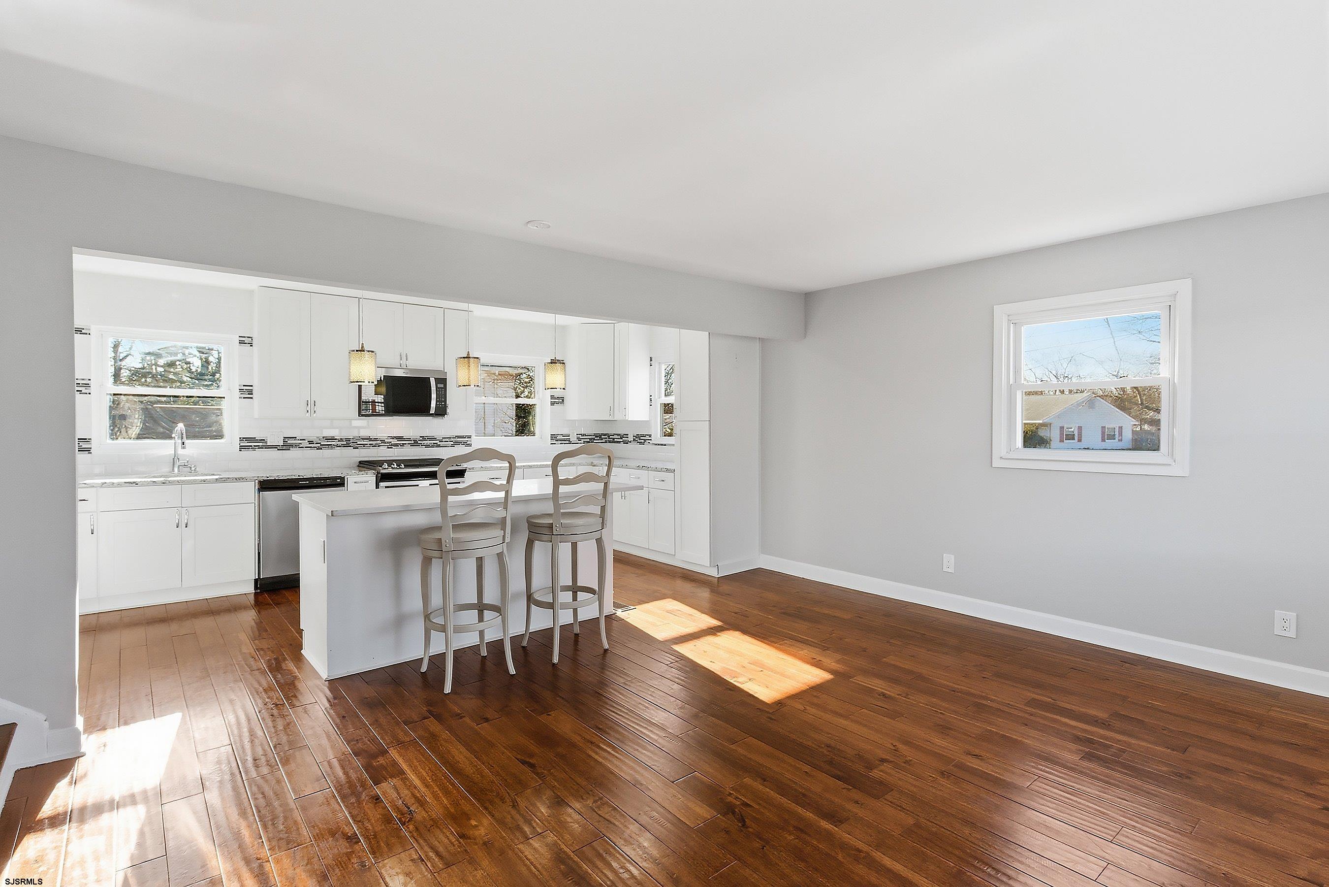 183 Jordan Road Somers Point, NJ 08244 - Photo 9 of 42 a kitchen with stainless steel appliances a refrigerator and a stove top oven