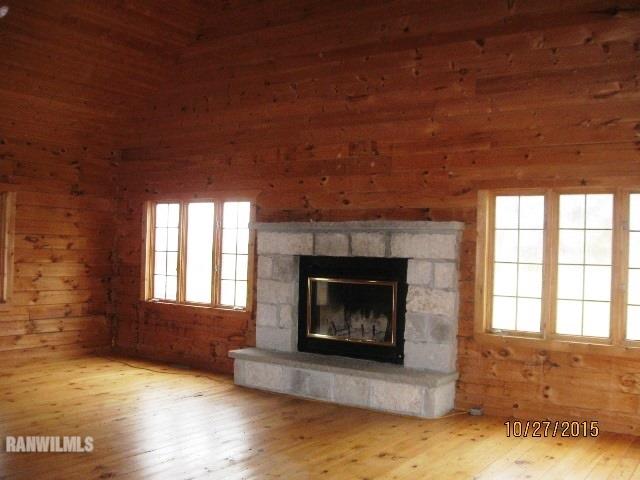 21563 Yorktown Road Chadwick, IL 61014 - Photo 6 of 23 a living room with a fireplace in it