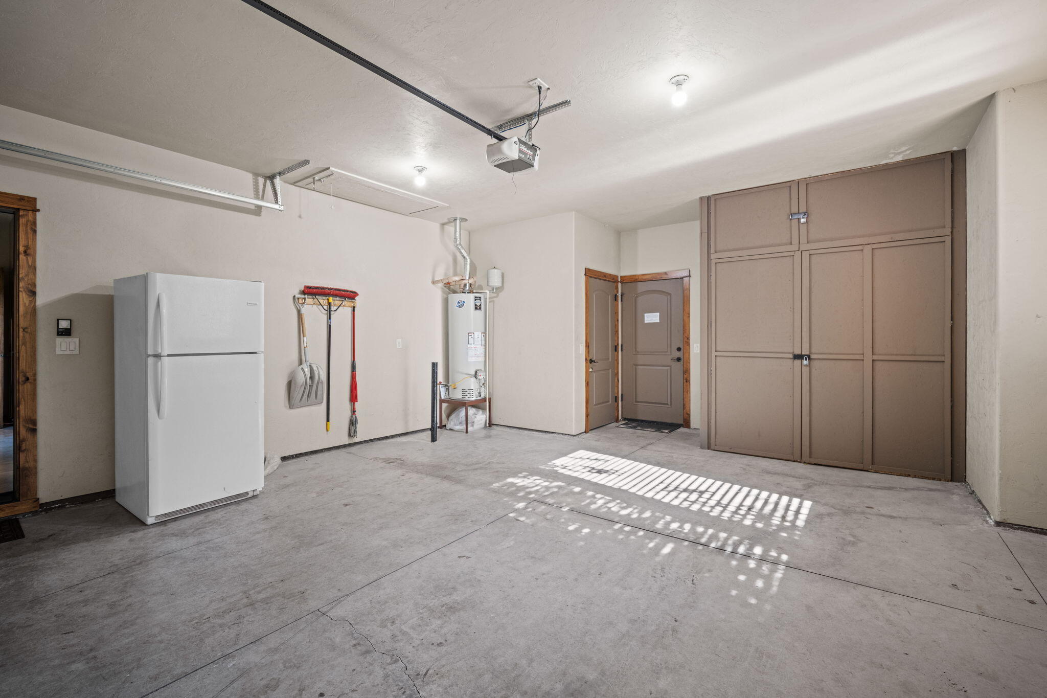 56508 Dancing Rock Loop, Unit 22 Bend, OR 97707 - Photo 53 of 69 a view of empty room with refrigerator and ceiling fan