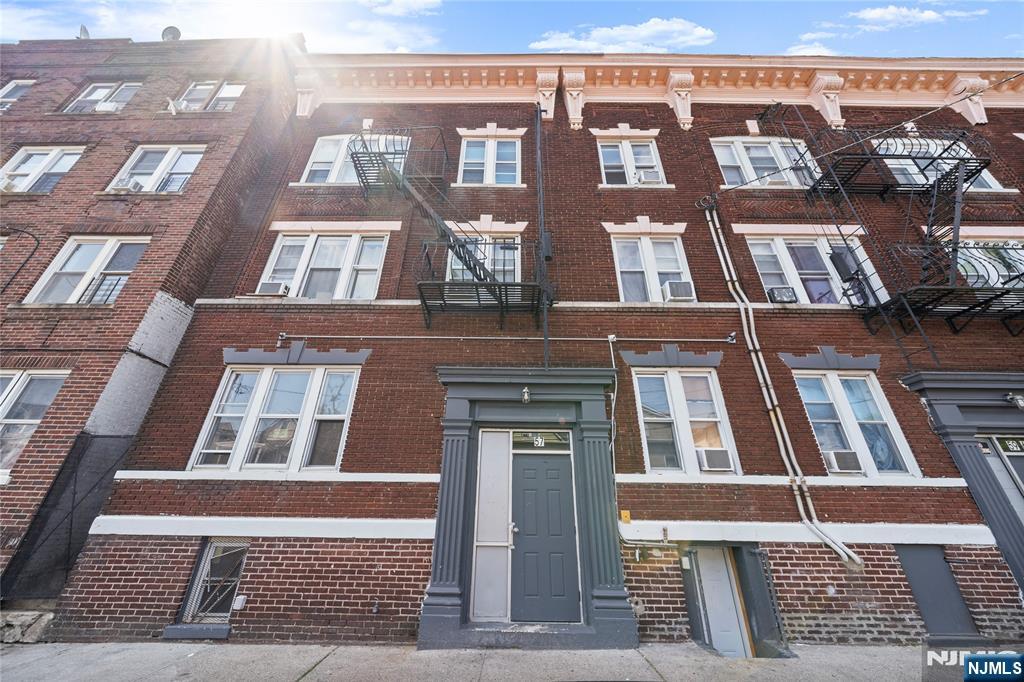 53 Henry Street, Unit D1 Passaic, NJ 07055 - Photo 1 of 16 front view of a building