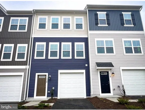 a front view of a building with many windows