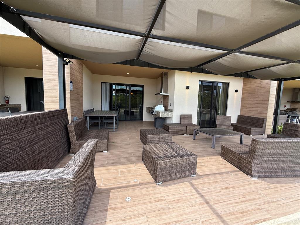 3065 Rockefeller Way Kissimmee, FL 34747 - Photo 15 of 59 a living room with furniture and a flat screen tv
