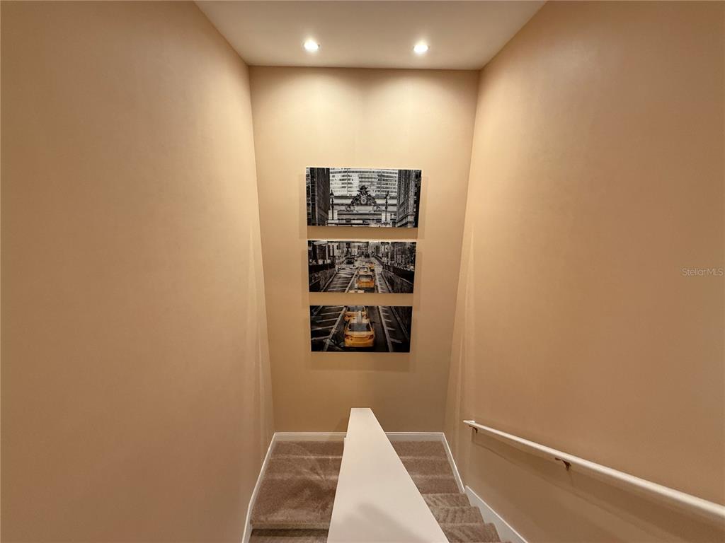 3065 Rockefeller Way Kissimmee, FL 34747 - Photo 16 of 59 a view of a hallway with wooden floor