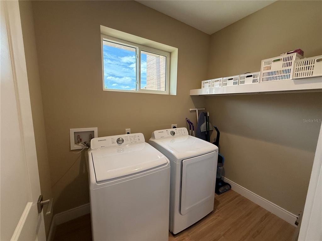 3065 Rockefeller Way Kissimmee, FL 34747 - Photo 20 of 59 a utility room with dryer and washer