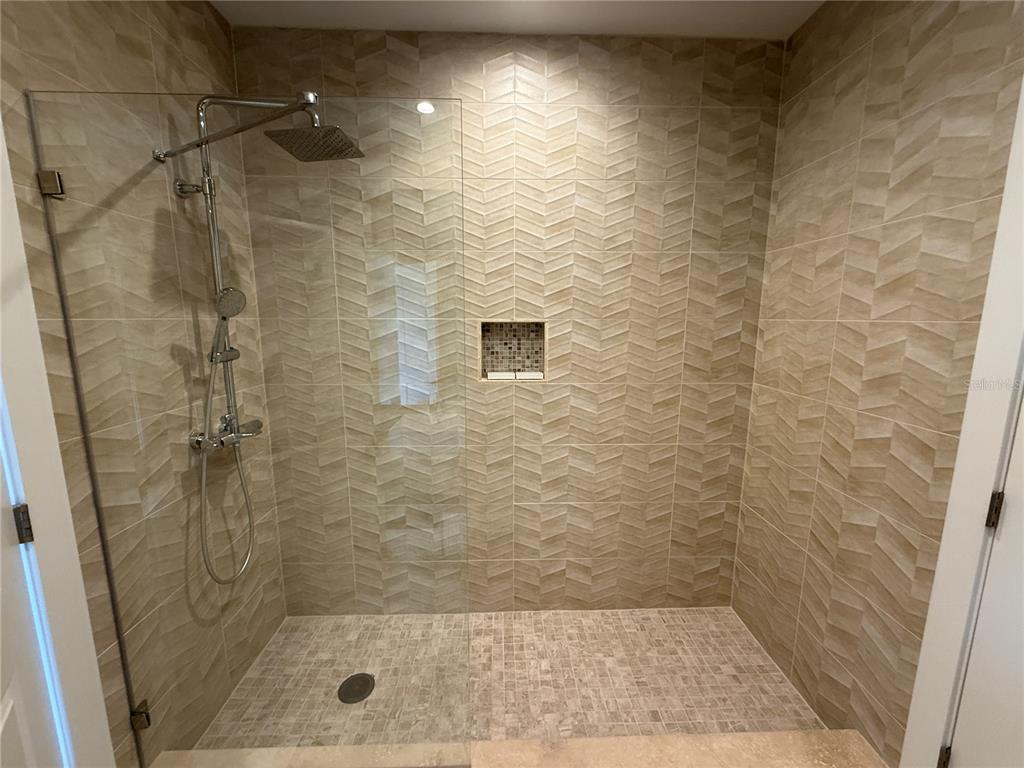 3065 Rockefeller Way Kissimmee, FL 34747 - Photo 30 of 59 a bathroom with a shower