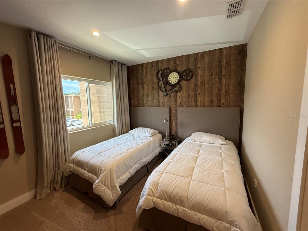 3065 Rockefeller Way Kissimmee, FL 34747 - Photo 36 of 59 a bedroom with 2 bed and a window