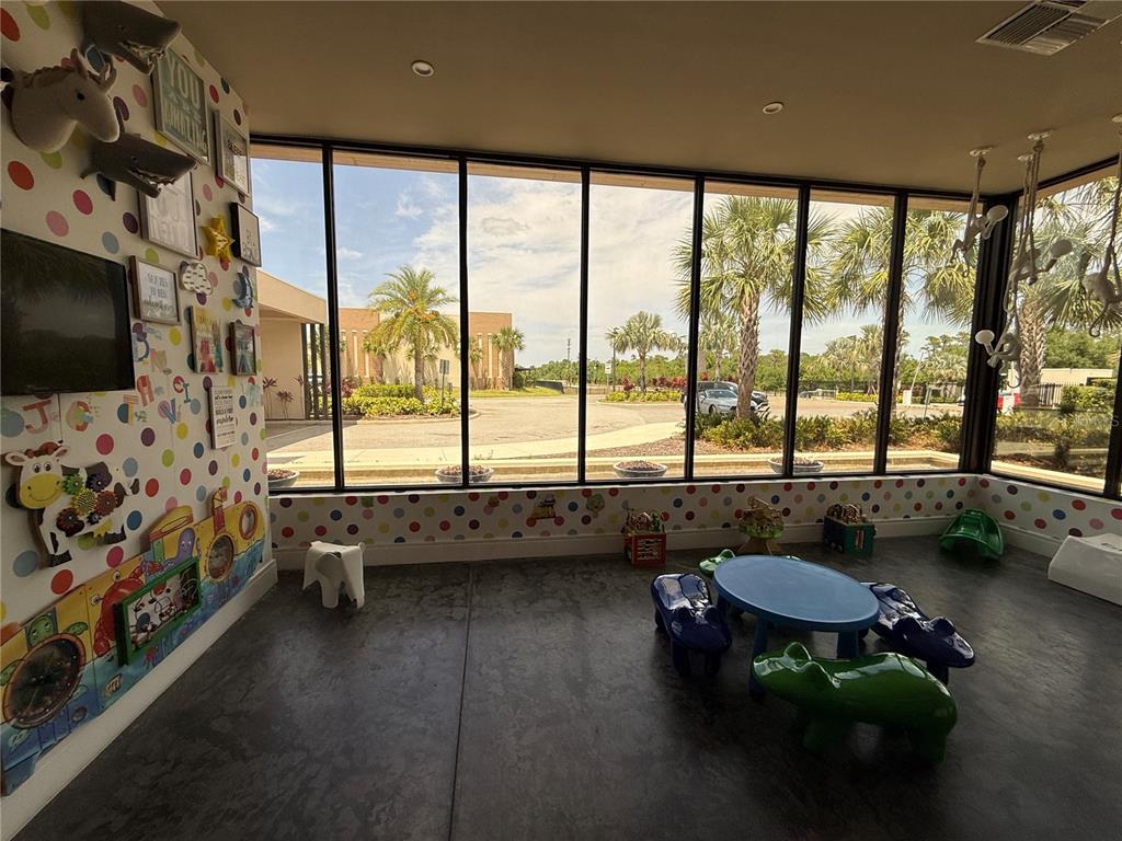 3065 Rockefeller Way Kissimmee, FL 34747 - Photo 44 of 59 a living room with furniture and a flat screen tv