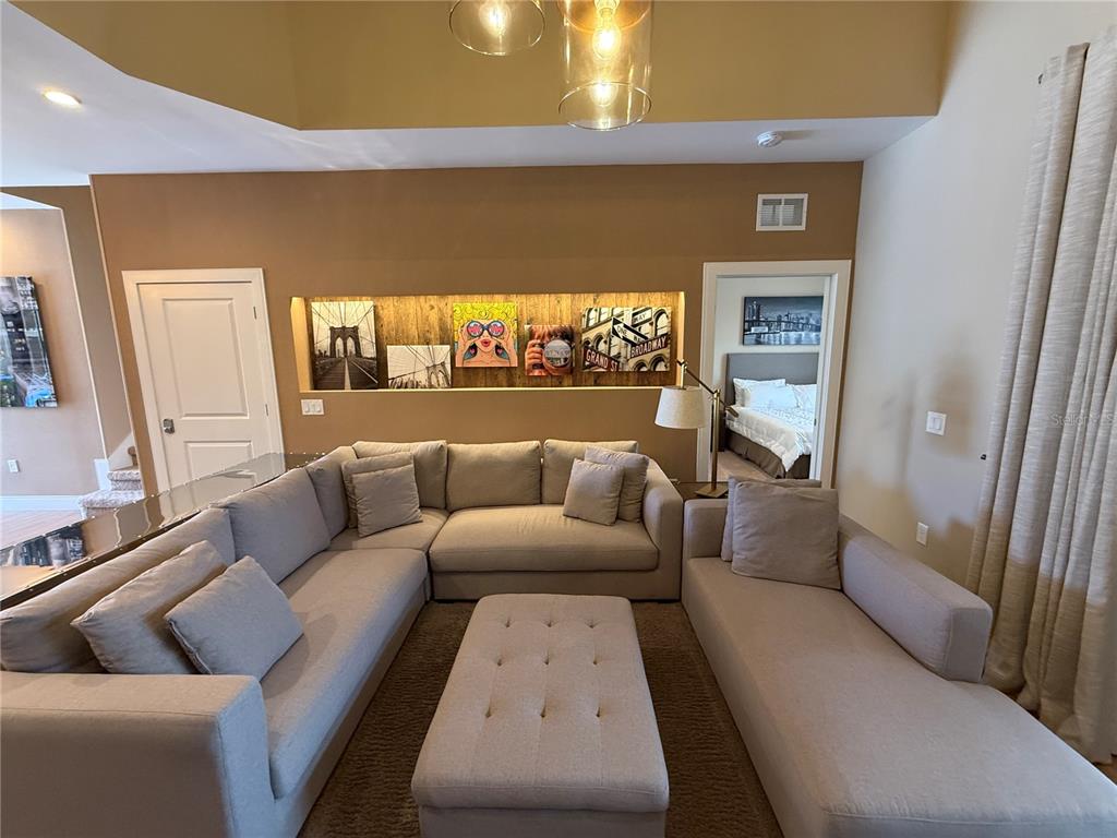 3065 Rockefeller Way Kissimmee, FL 34747 - Photo 5 of 59 a living room with furniture and a flat screen tv