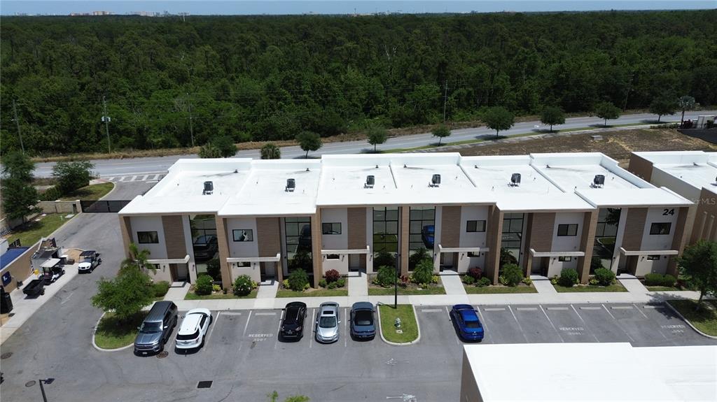 3065 Rockefeller Way Kissimmee, FL 34747 - Photo 56 of 59 a view of white house with sitting area and potted plants