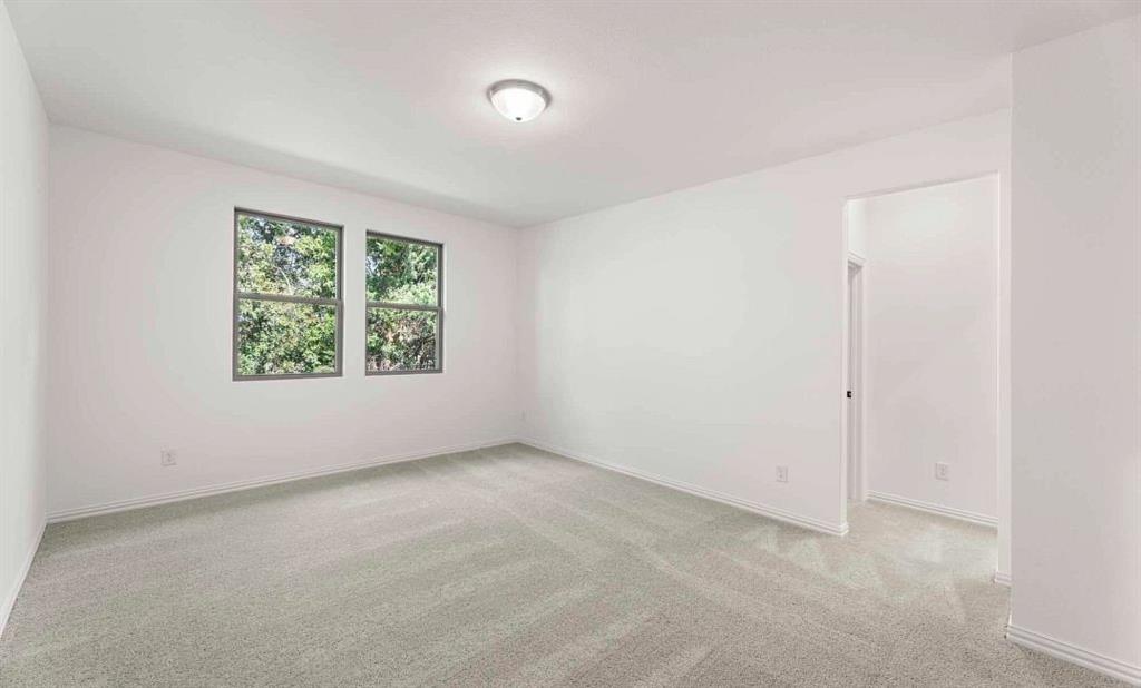 14204 Gallatin Street Pilot Point, TX 76258 - Photo 11 of 14 an empty room with windows and closet