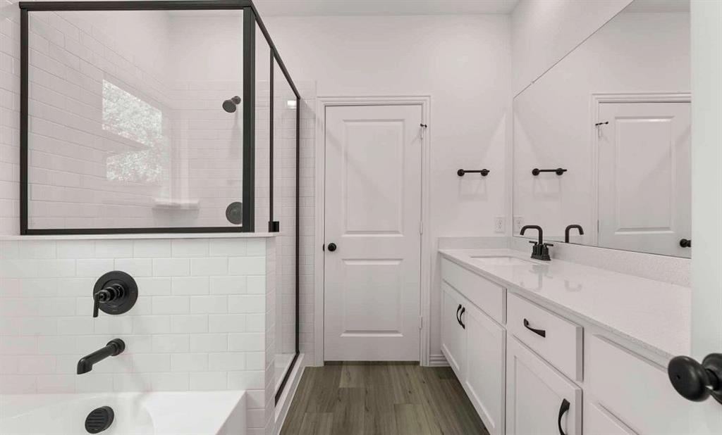 14204 Gallatin Street Pilot Point, TX 76258 - Photo 12 of 14 a bathroom with a tub sink and mirror