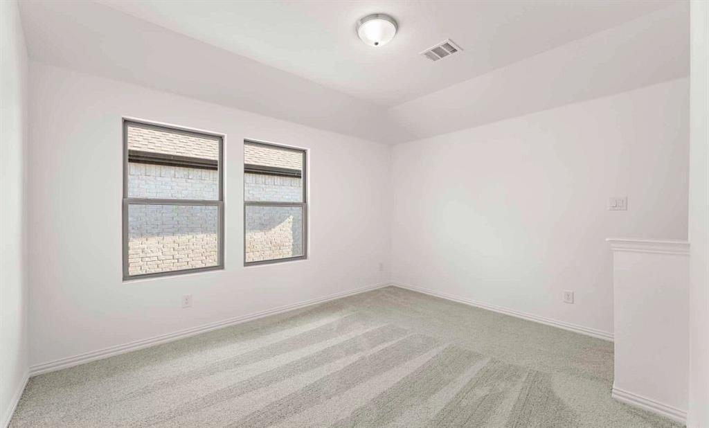 14204 Gallatin Street Pilot Point, TX 76258 - Photo 14 of 14 an empty room with a window