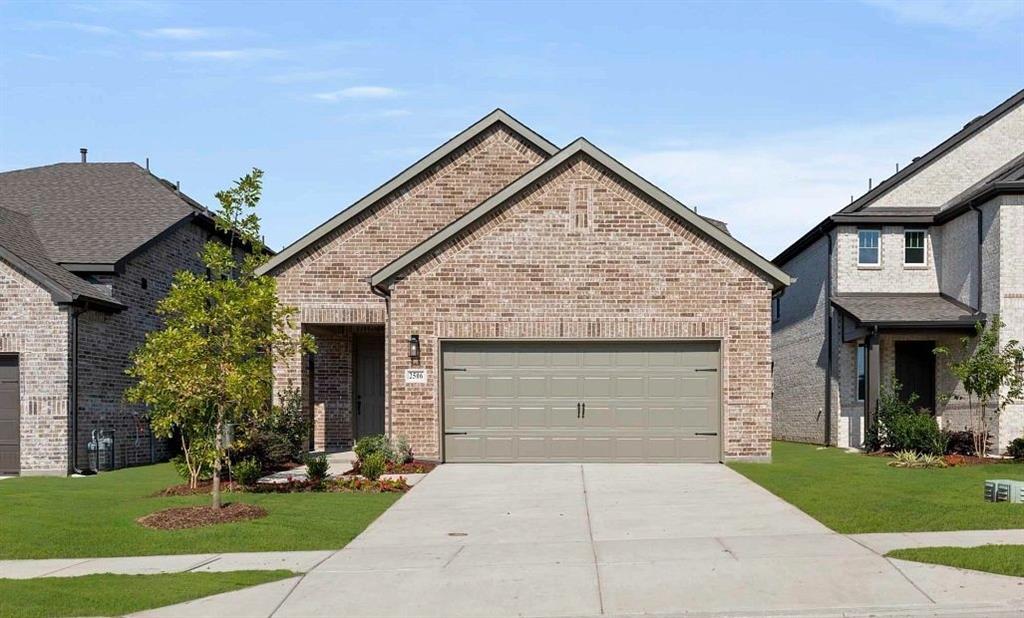 14204 Gallatin Street Pilot Point, TX 76258 - Photo 2 of 14 a front view of a house with a garden and plants