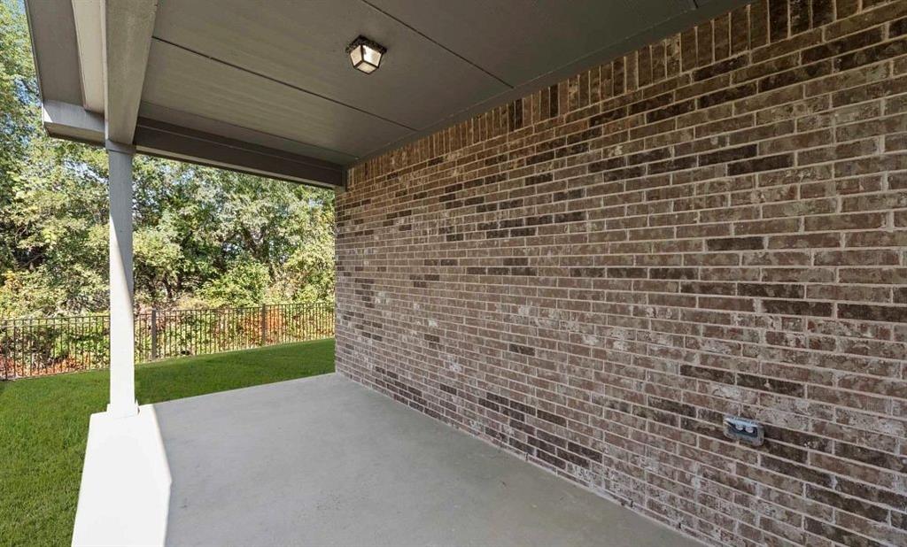 14204 Gallatin Street Pilot Point, TX 76258 - Photo 3 of 14 a view of a pathway both side of building