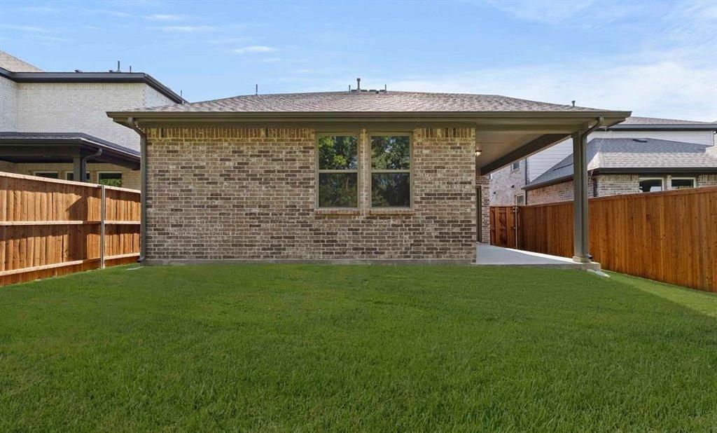 14204 Gallatin Street Pilot Point, TX 76258 - Photo 4 of 14 a front view of a house with a yard