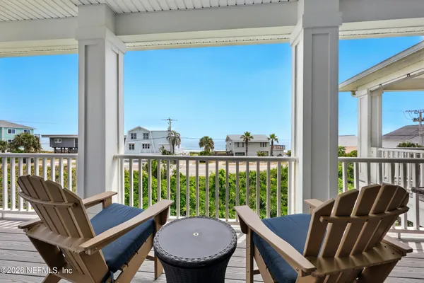 a spacious bedroom with a bed and a flat screen television