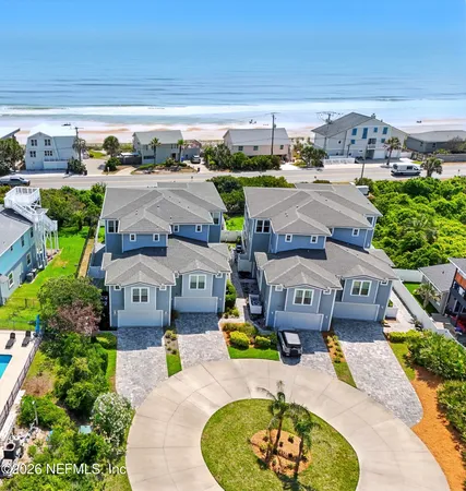 a view of swimming pool with outdoor seating and a garden