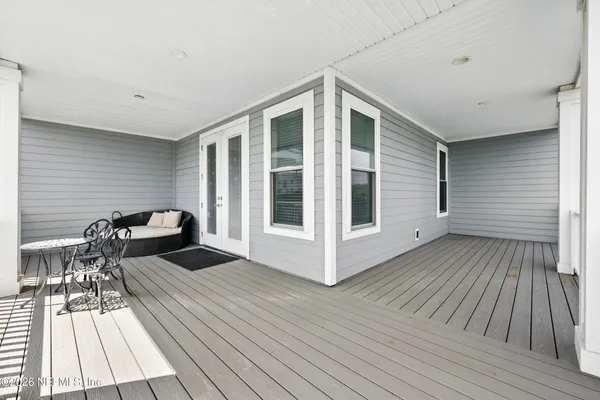 a bedroom with a bed and a baby crib