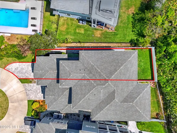 a kitchen with stainless steel appliances granite countertop a table chairs sink and cabinets