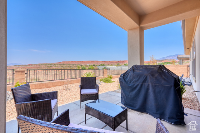 1329 Paseos Street Washington, UT 84780 - Photo 24 of 35 Fenced backyard featuring a patio, grilling area, and a mountain view
