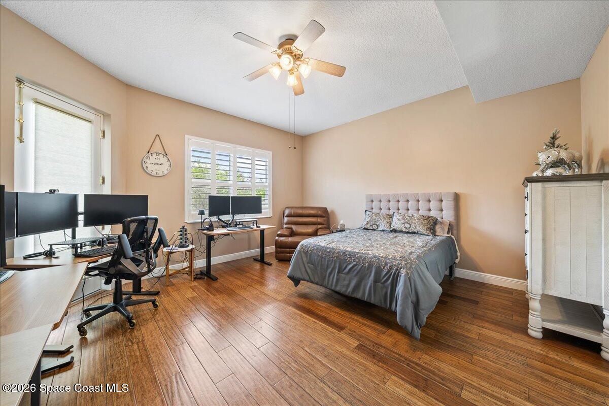 6005 Highway 1, Unit 101 Rockledge, FL 32955 - Photo 28 of 57 a spacious bedroom with a bed and a table in it