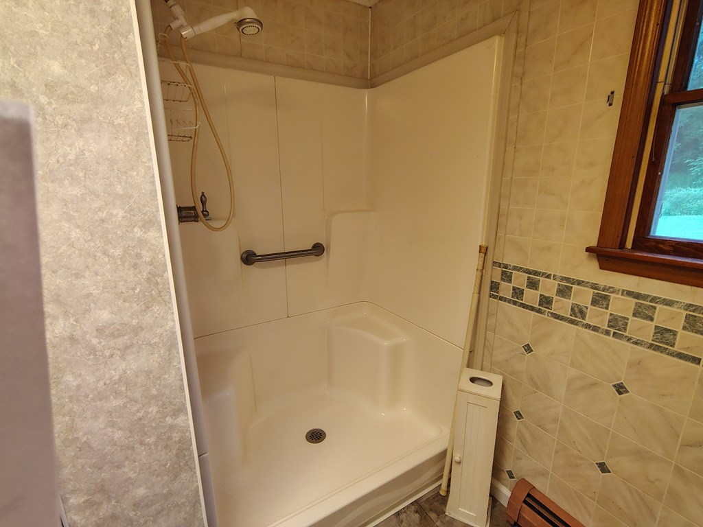 134 Railroad Street Oak Ridge, PA 16245 - Photo 11 of 20 a bathroom with a tub and a shower