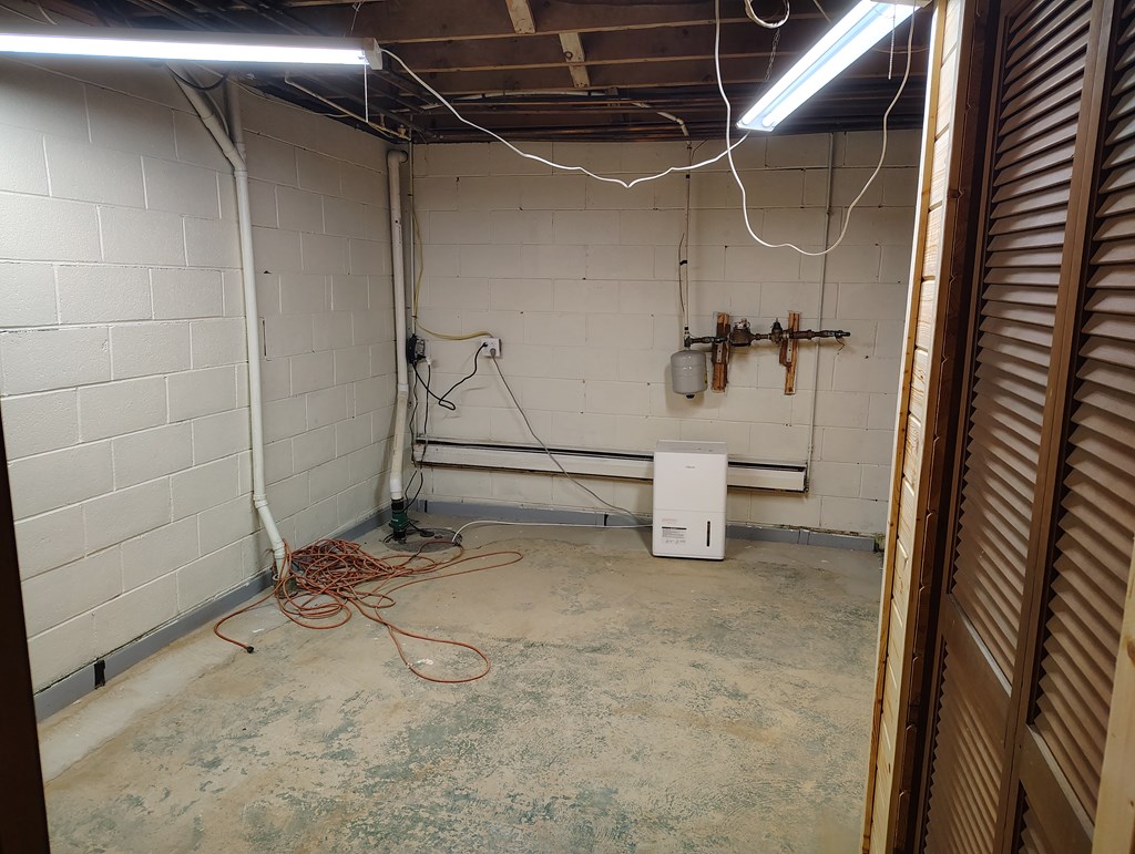134 Railroad Street Oak Ridge, PA 16245 - Photo 19 of 20 a view of a room with rack on the wall