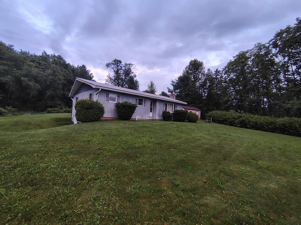 134 Railroad Street Oak Ridge, PA 16245 - Photo 2 of 20 a view of a house with backyard and garden