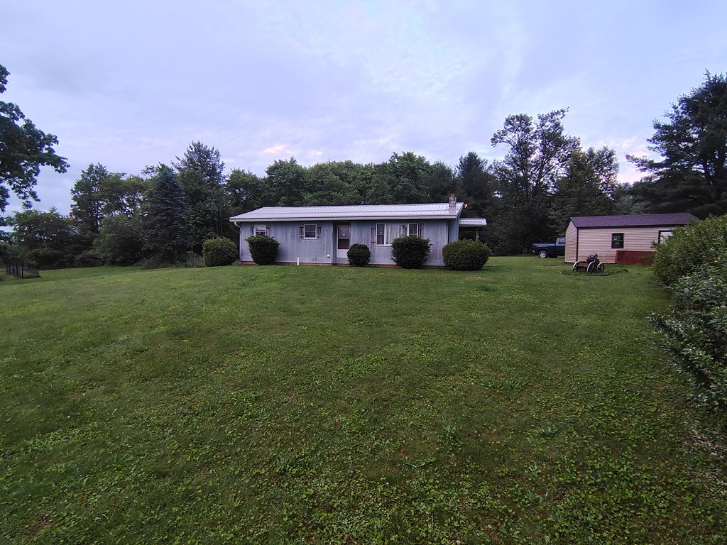 134 Railroad Street Oak Ridge, PA 16245 - Photo 3 of 20 front view of a house with a yard