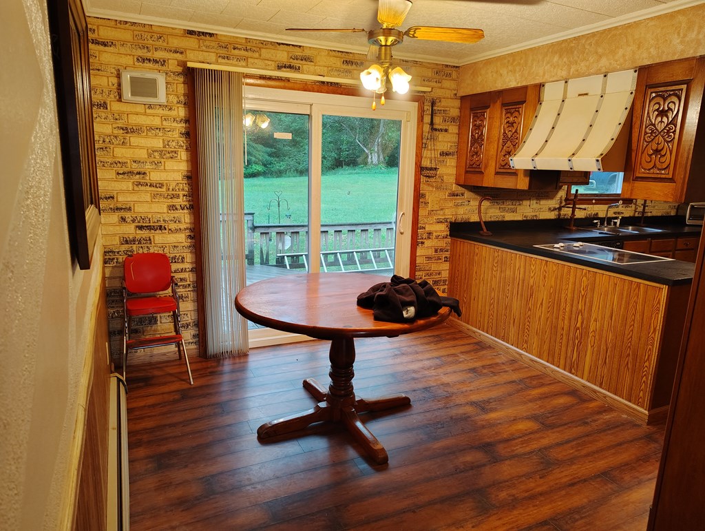 134 Railroad Street Oak Ridge, PA 16245 - Photo 8 of 20 a living room with furniture a window and gym equipment