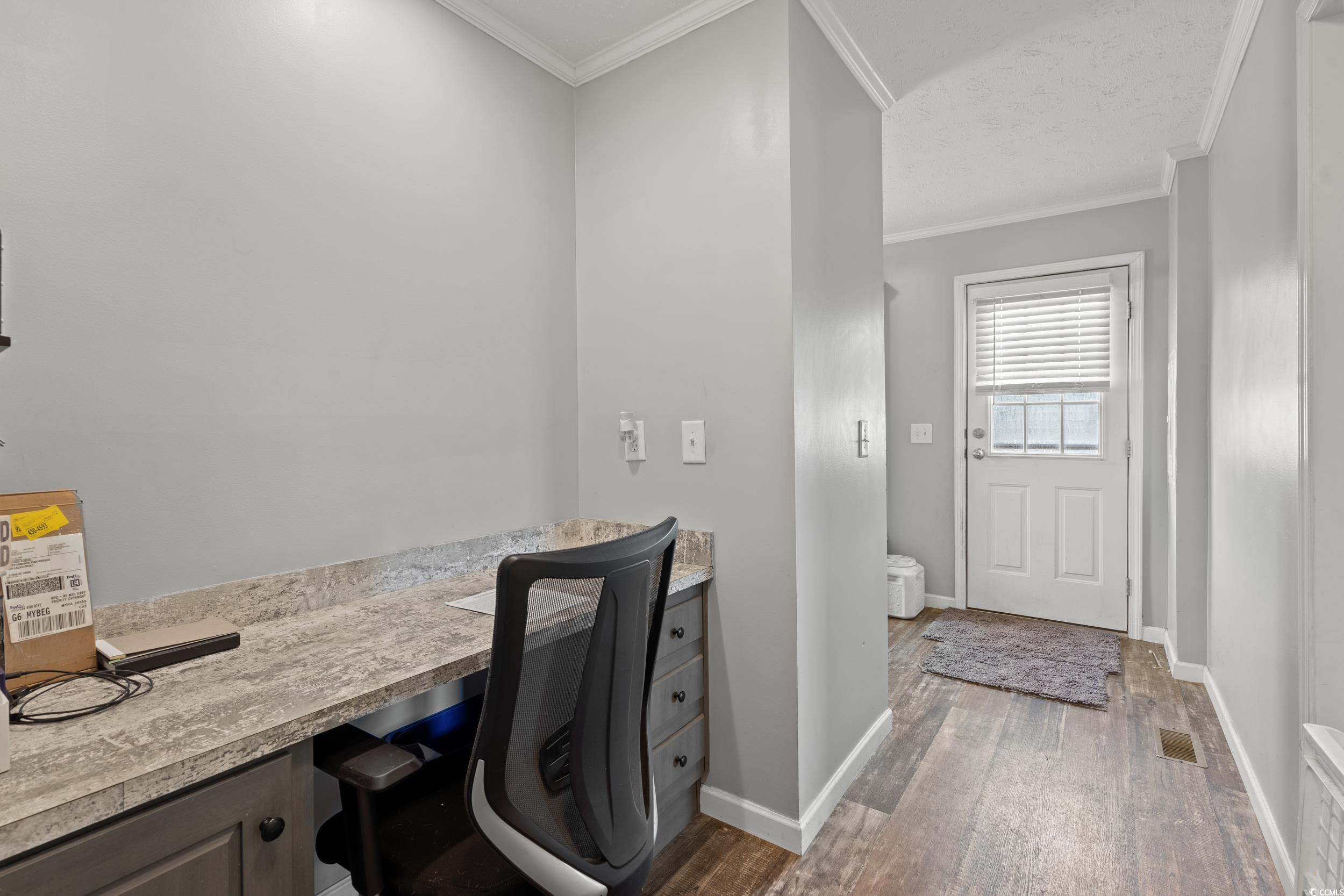399 Calico Road Loris, SC 29569 - Photo 20 of 30 Bathroom featuring wood finished floors and ornamental molding
