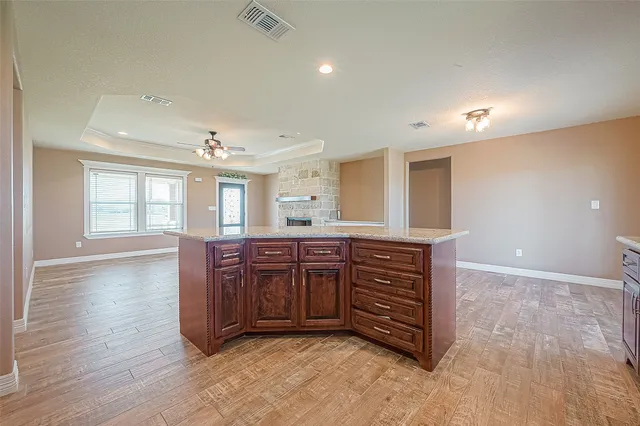 a view of kitchen with cabinets and wooden floor