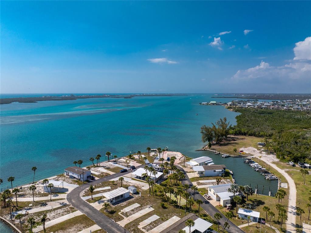 7500 Park Pointe Drive, Unit 42 Englewood, FL 34224 - Photo 19 of 33 view of a lake with beach
