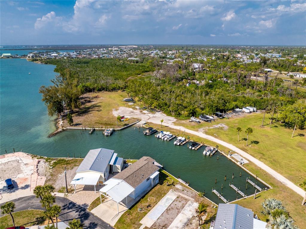 7500 Park Pointe Drive, Unit 42 Englewood, FL 34224 - Photo 25 of 33 an aerial view of ocean and residential houses with outdoor space