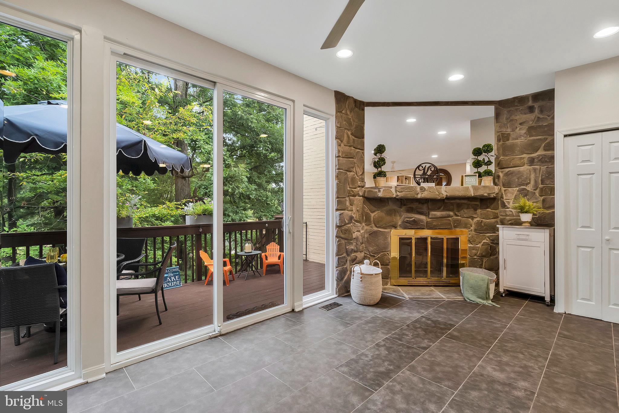 2026 Chadds Ford Drive Reston, VA 20191 - Photo 15 of 45 Enjoy sitting by the fireplace with a water view!