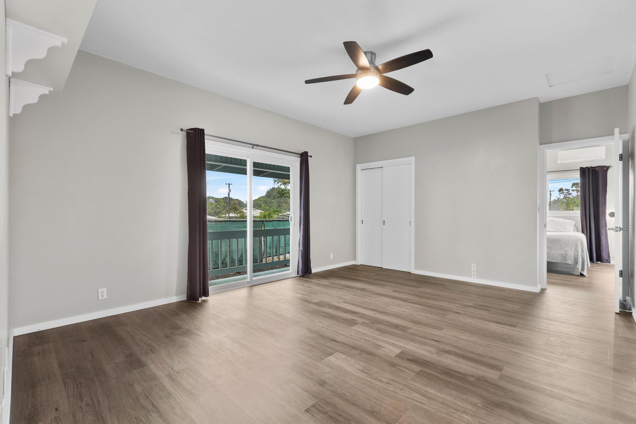 234 Kipa Street Hilo, HI 96720 - Photo 15 of 30 an empty room with wooden floor and windows