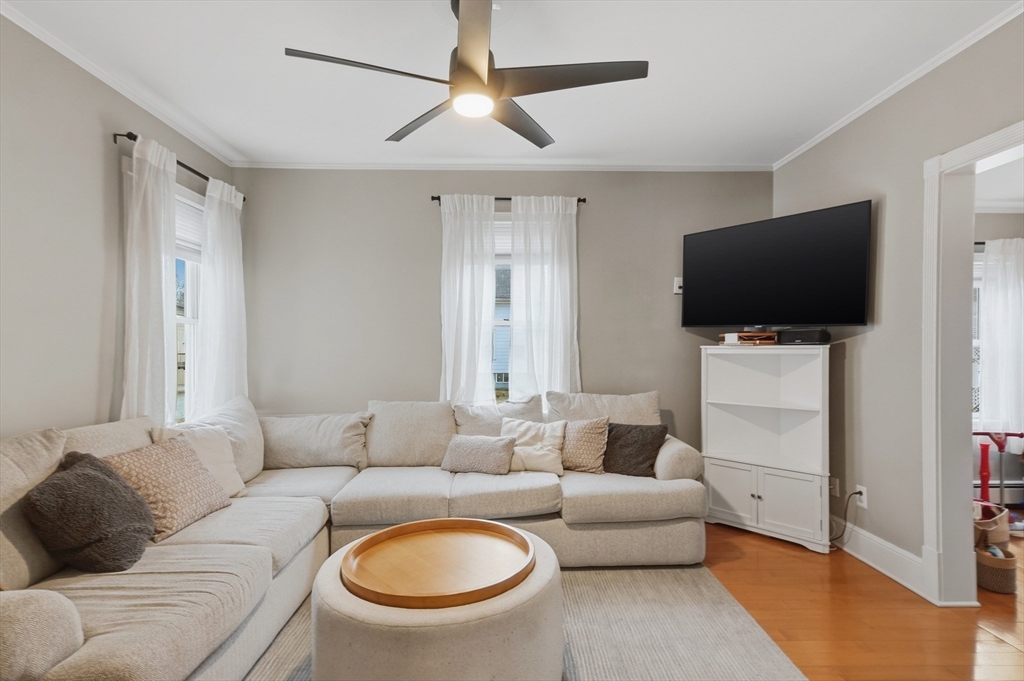 24 Minot Street Reading, MA 01867 - Photo 11 of 34 a living room with furniture and a flat screen tv