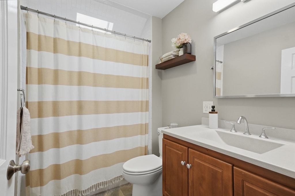24 Minot Street Reading, MA 01867 - Photo 17 of 34 a bathroom with a sink toilet and shower