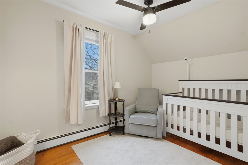 24 Minot Street Reading, MA 01867 - Photo 18 of 34 a bedroom with furniture and a window