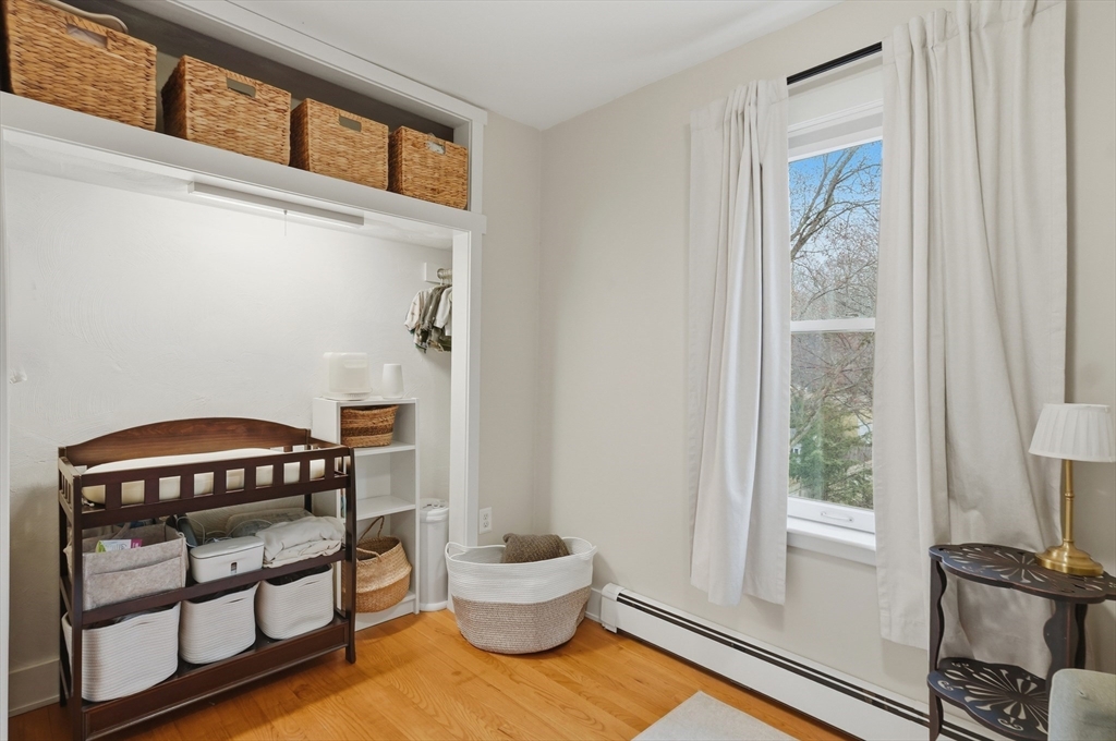24 Minot Street Reading, MA 01867 - Photo 19 of 34 a view of a bedroom with furniture and a window