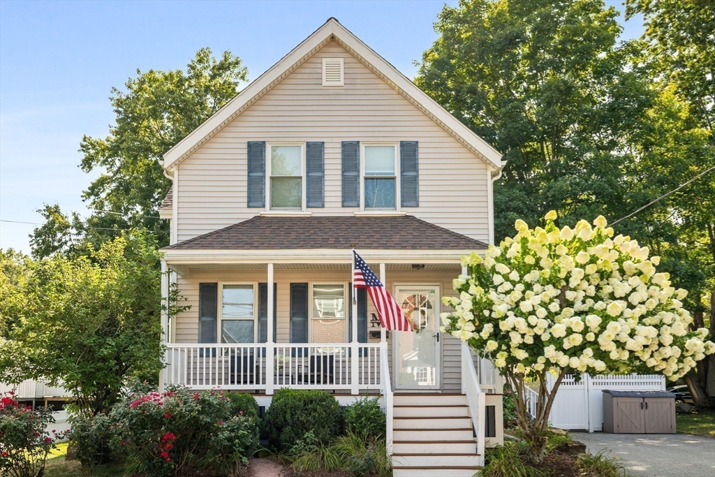 24 Minot Street Reading, MA 01867 - Photo 2 of 34 a front view of a house with a garden