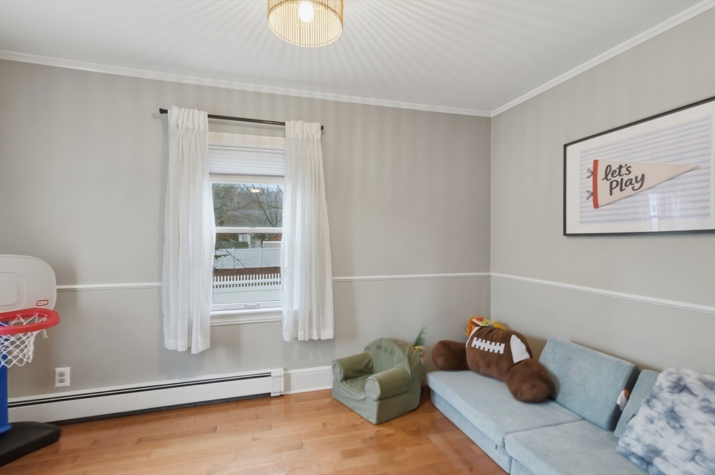 24 Minot Street Reading, MA 01867 - Photo 24 of 34 a living room with furniture and a window