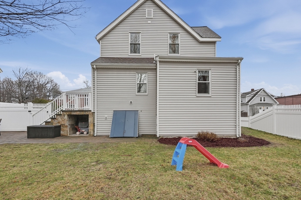 24 Minot Street Reading, MA 01867 - Photo 30 of 34 a view of a house with a backyard