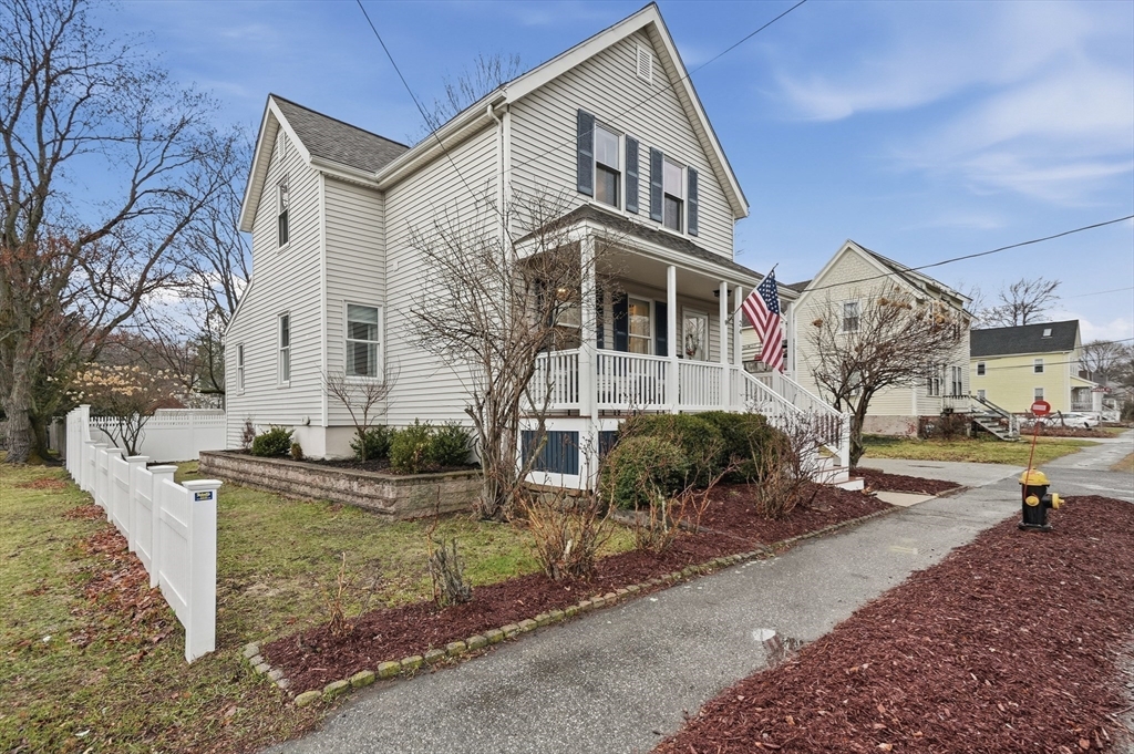 24 Minot Street Reading, MA 01867 - Photo 4 of 34 a front view of a house with garden
