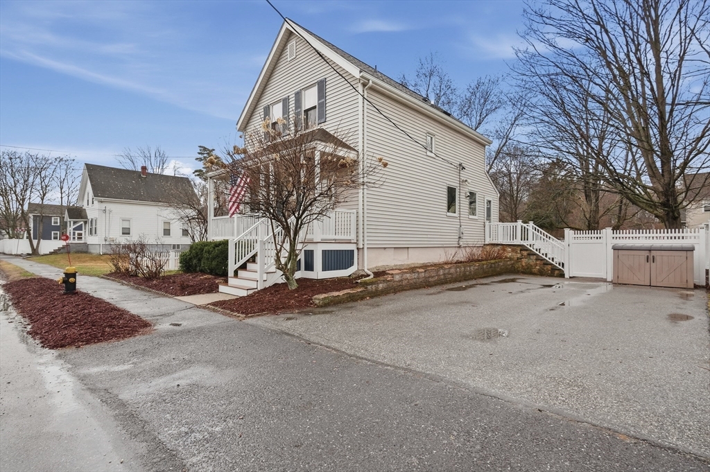 24 Minot Street Reading, MA 01867 - Photo 5 of 34 a view of a house with a yard
