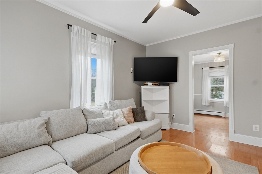 24 Minot Street Reading, MA 01867 - Photo 10 of 34 a living room with furniture and a flat screen tv